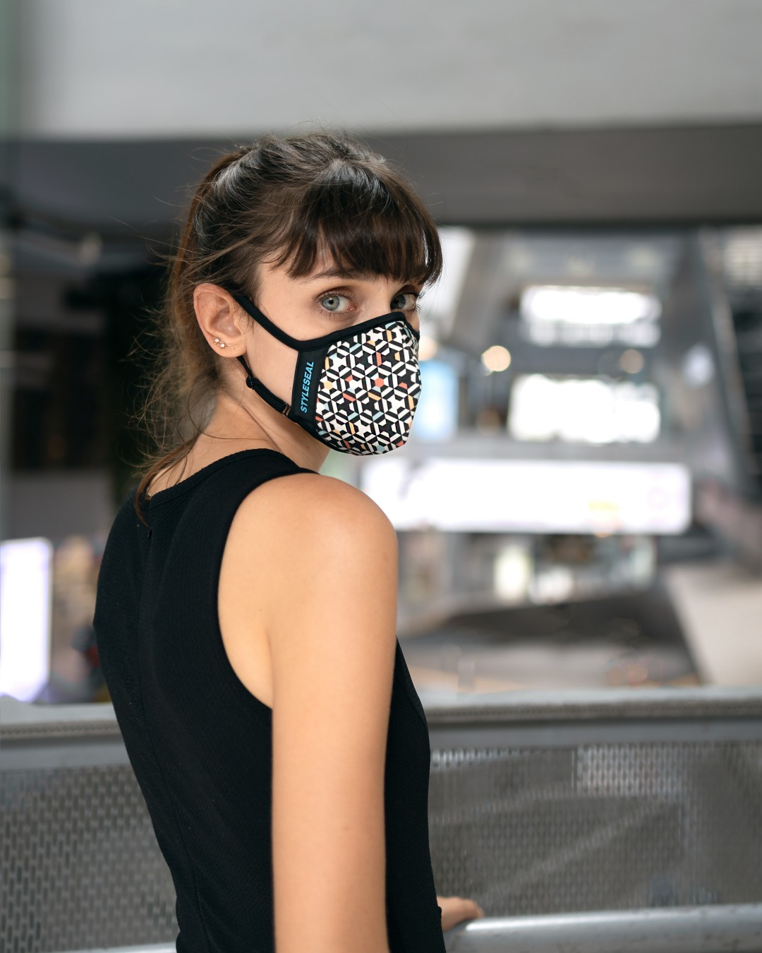 woman wearing geometric color styleseal pro reusable face mask