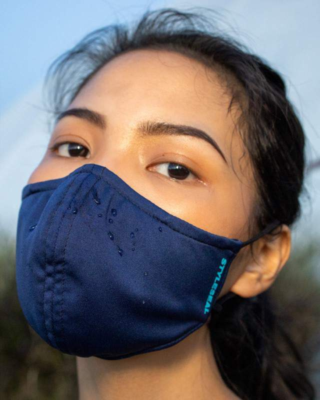 woman wearing styleseal water repellent basic face mask navy blue